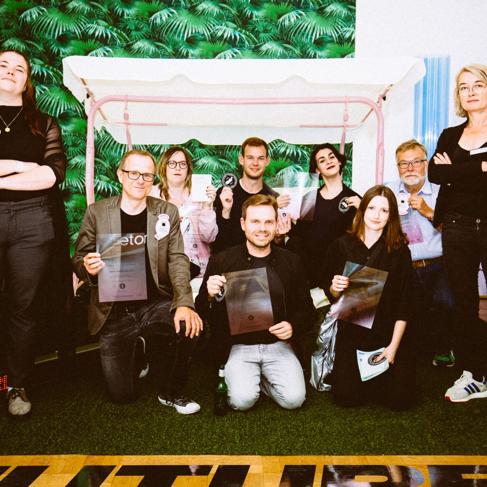 Graduates of the Academy of the Avant-garde and teachers pose with certificates of participation and badges