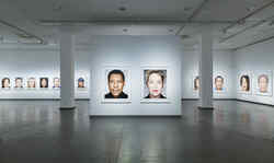 Exhibition view of the series Close Up from the exhibition Martin Schoeller with portraits of celebrities hanging next to each other